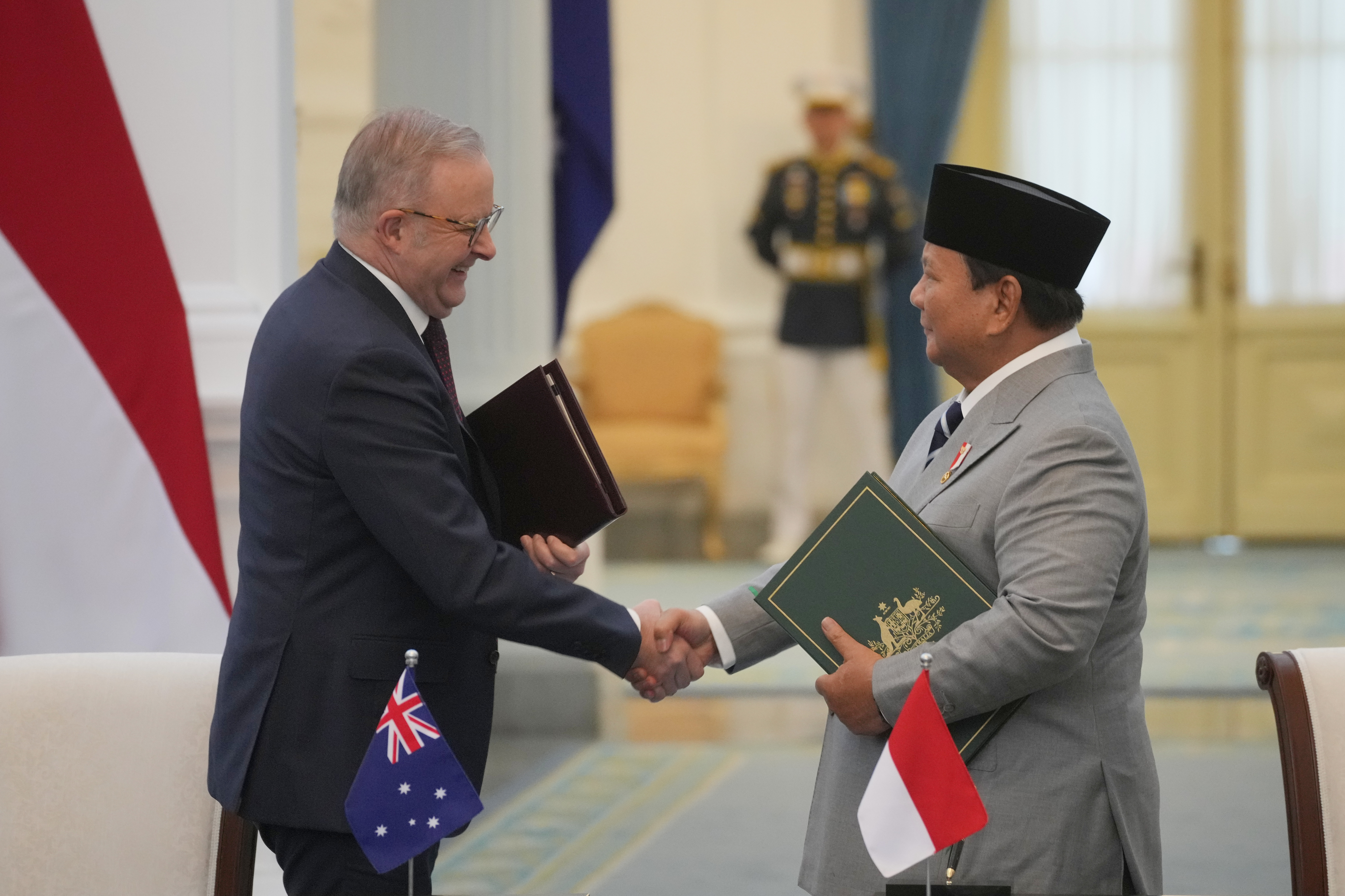 Leaders of Indonesia and Australia sign a new security treaty to affirm ...