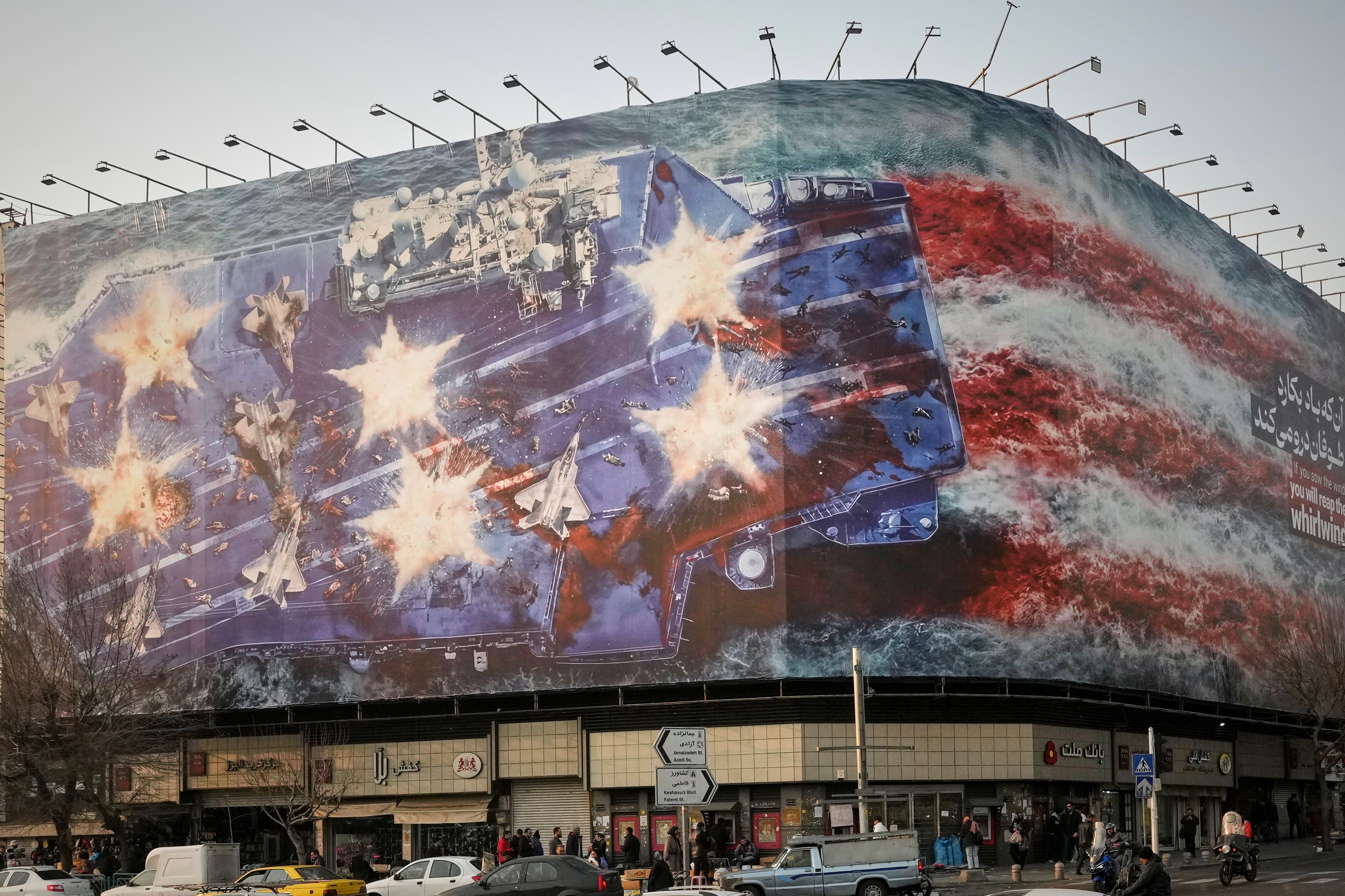 Iran unveils mural warning of retaliation if US conducts a military ...